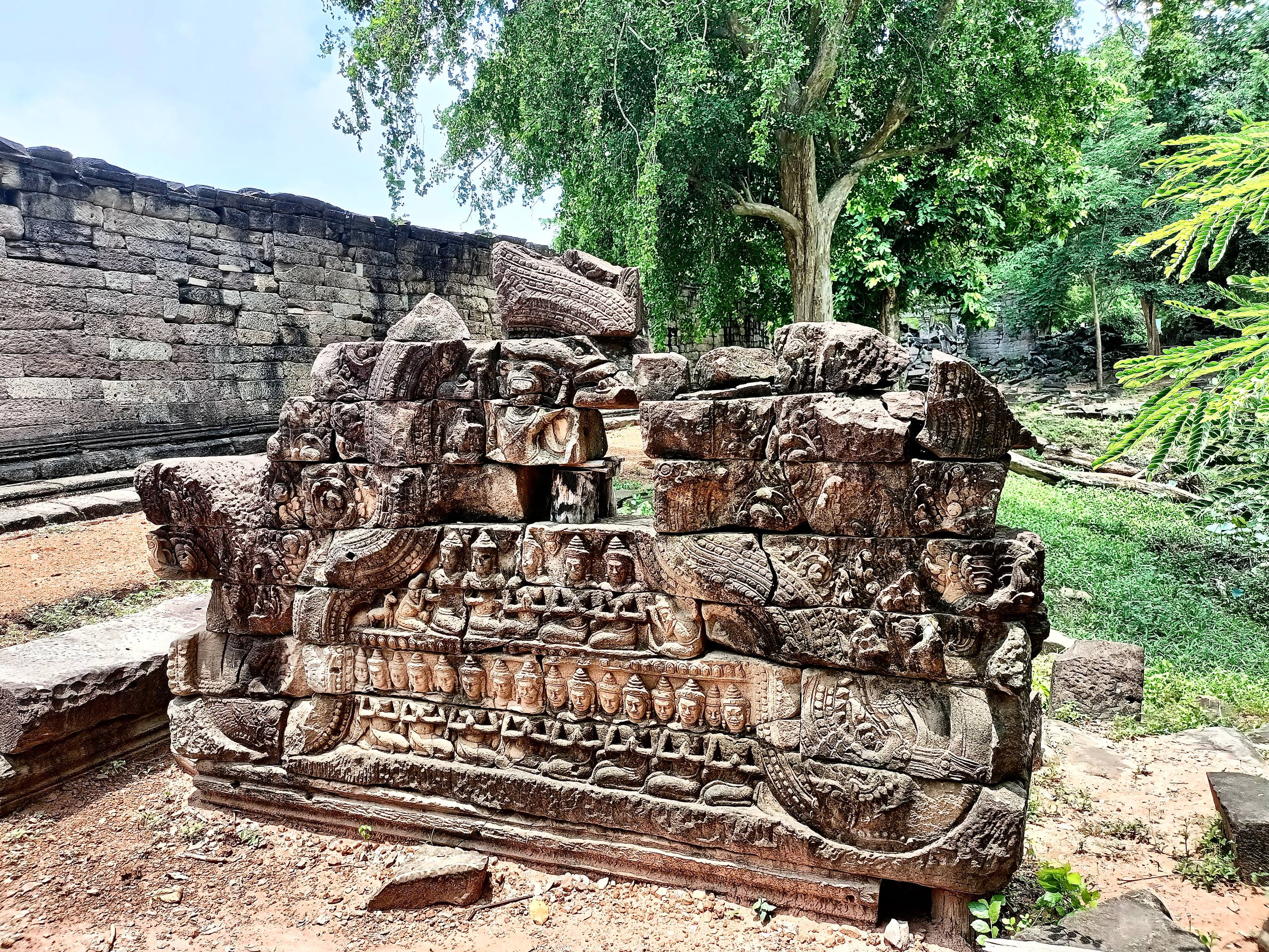 Ancient Khmer bas-relief carvings on the walls of Banteay Chhmar Temple.
