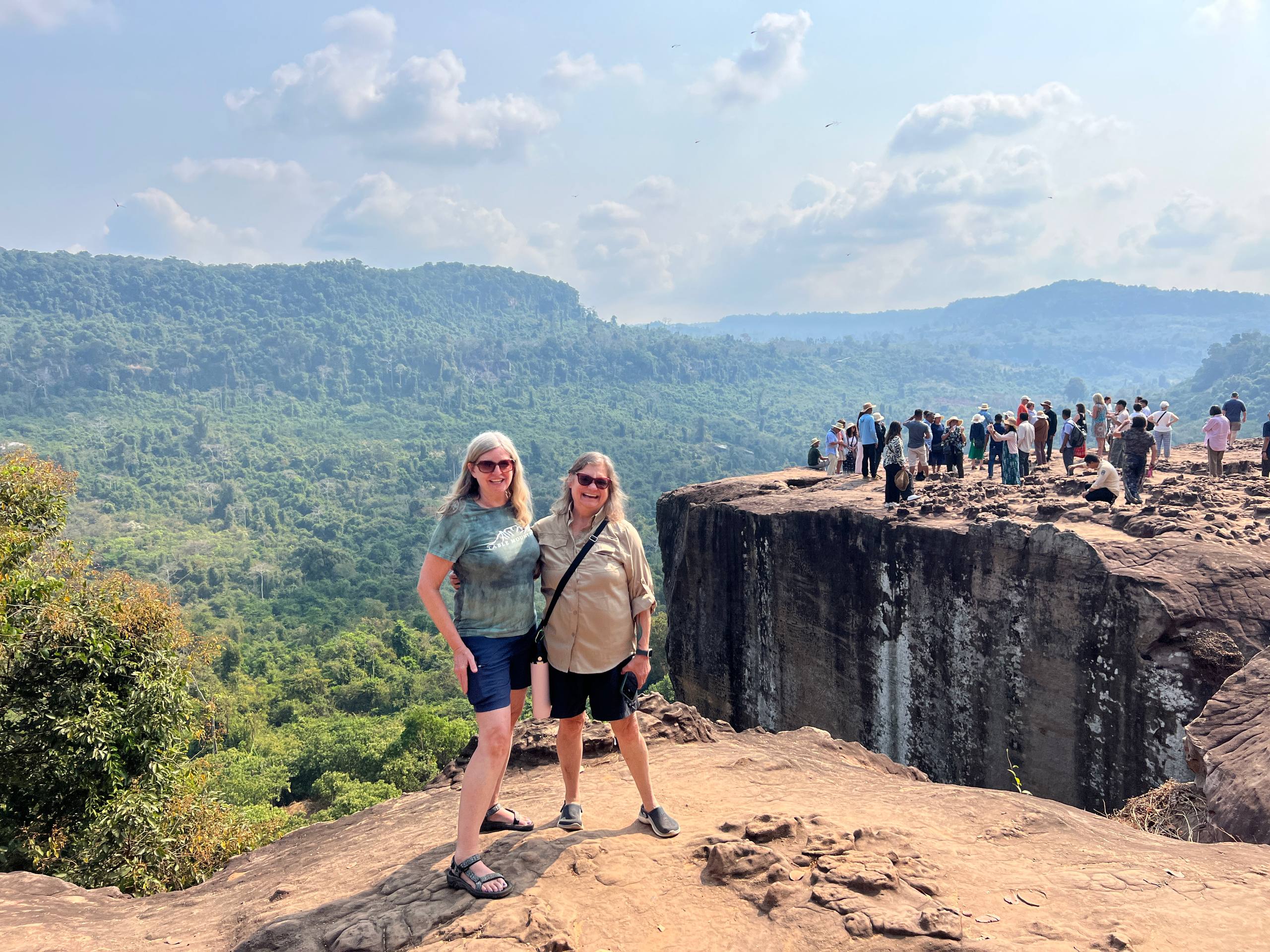 Enjoy a breathtaking panoramic view from the cliff of Phnom Kulen, Cambodia's sacred mountain.
