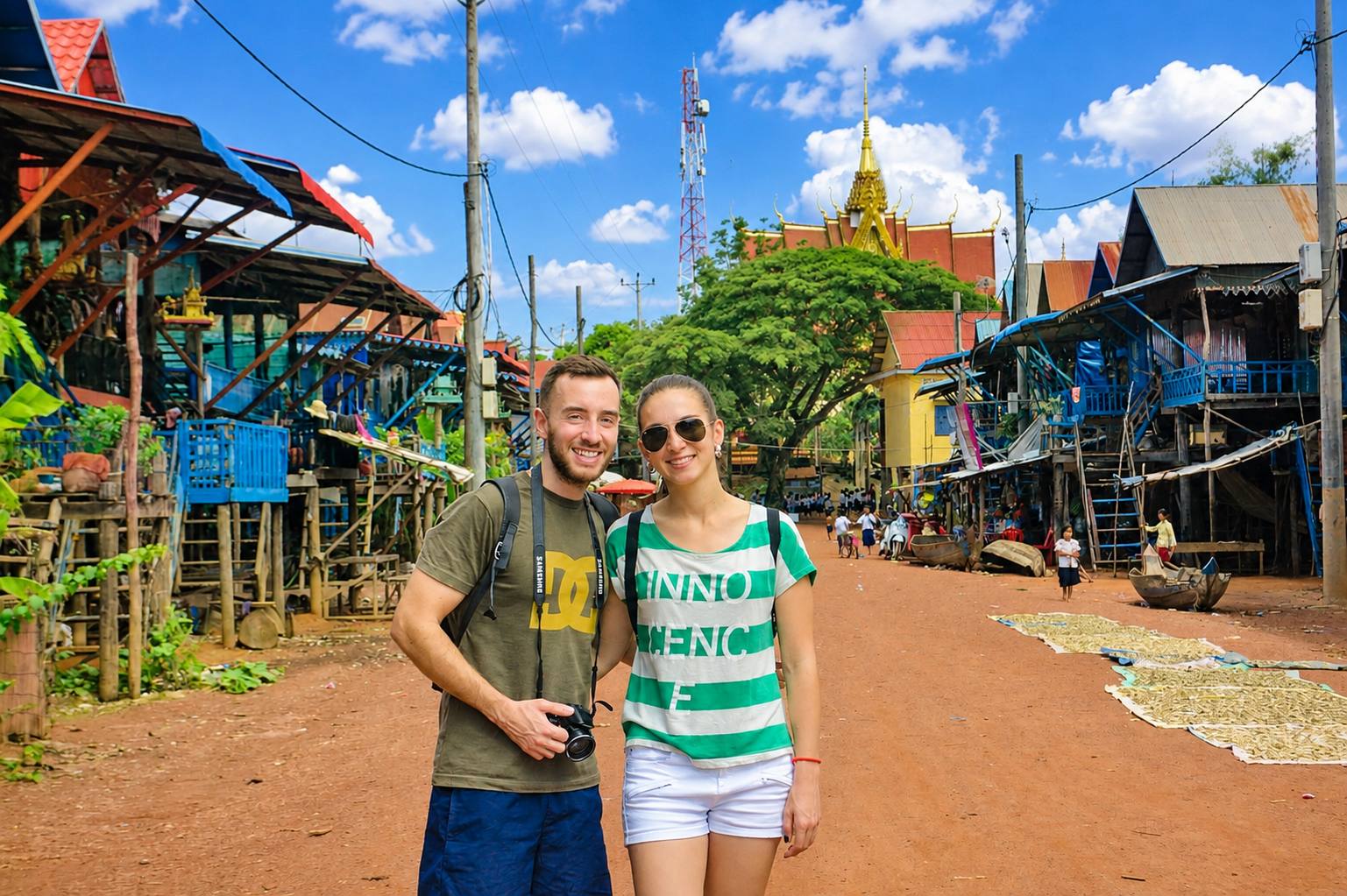 Visitors exploring the charming stilt-house community of Kampong Phluk Village, where local life unfolds along the Tonle Sap Lake.
